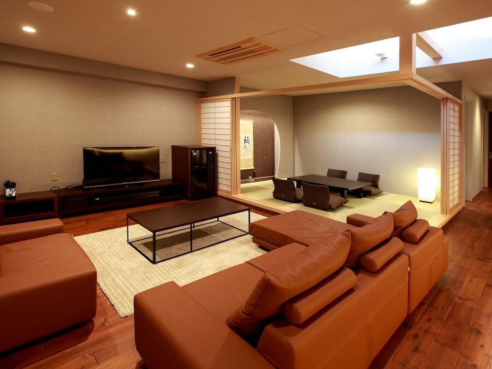 بيتش سايد أونسين ريزورت يومي غرفة