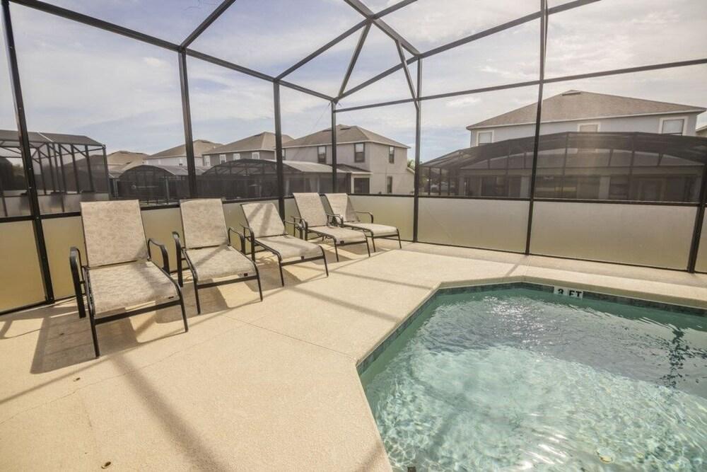 Elegant Providence Resort Pool Home 5 Bedroom Home by RedAwning Waterslide