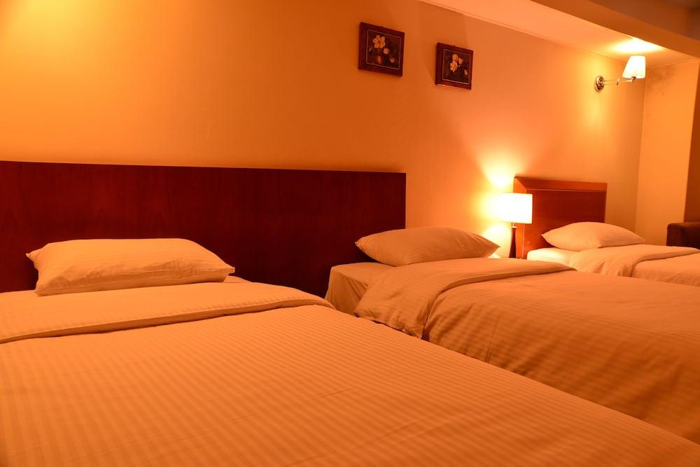 نيو كوريا هوتل غرفة