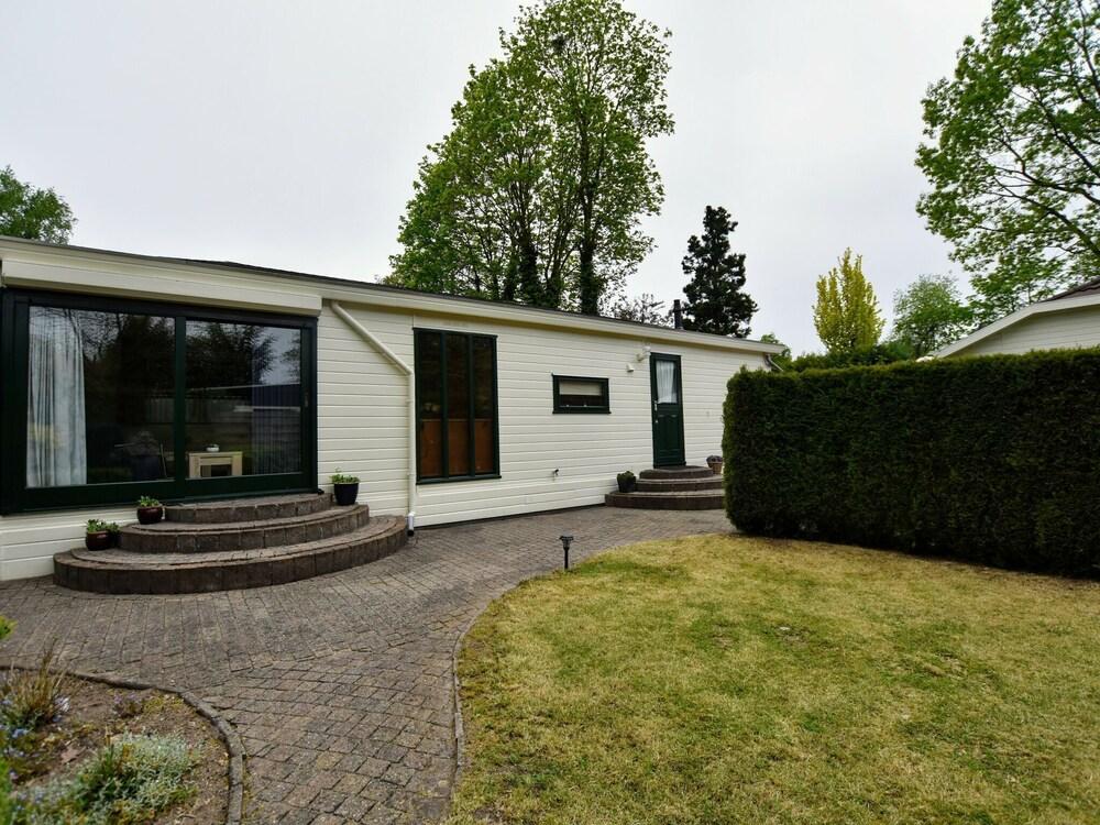 Spacious Chalet With Enclosed Garden in Small-scale Holiday Resort Adjacent to Forest Featured Image