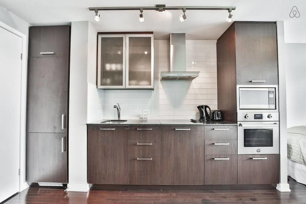 Modern Skyscraper Studio by CN Tower Featured Image