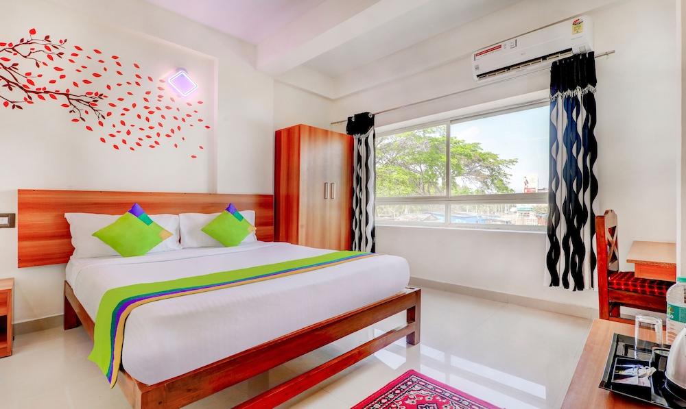 Treebo Atithi Comforts, 1 Km From Nisargadhama Forest Featured Image